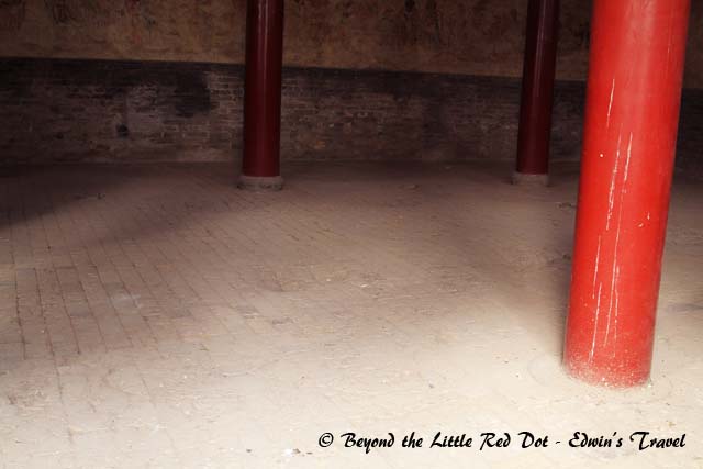The depressions in the floor are caused by the many monks who have trained by stamping their feet here. I think this was featured in the Shaolin kungfu movie starring Jet Li.