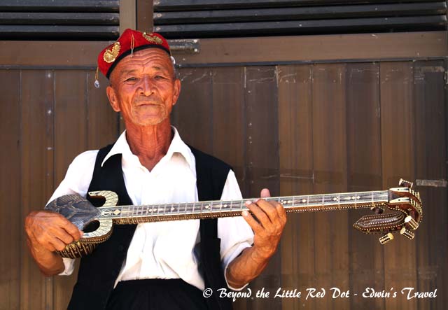 An enterprising old man who entertains you for some donations. You can play his musical instruments and take photos with him.
