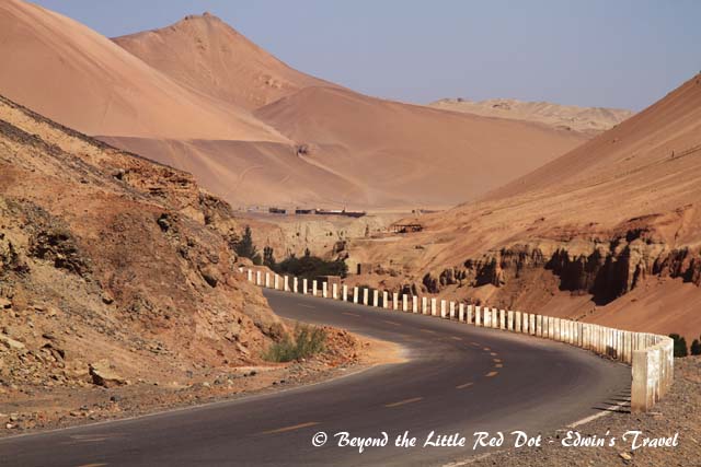 The desert highway that goes round to the back of the Flaming Mountains.