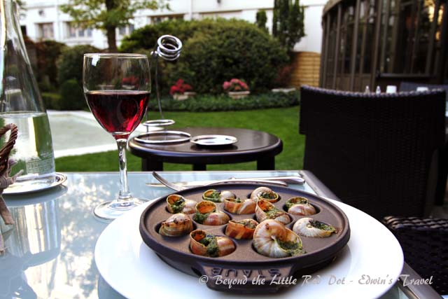 A dinner of Burgundy wine and escargot.