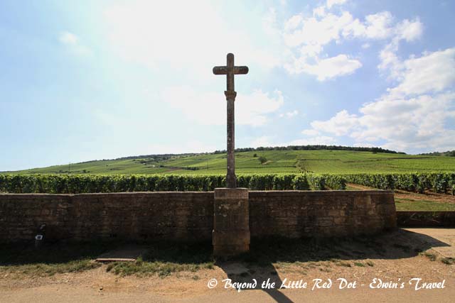 Behind the cross is the vineyard for the most expensive wine in Burgundy - Domaine de la Romanée-Conti at more than €3,000 per bottle and a 12 year waiting list.