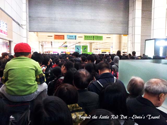 This is the start point after clearing Chinese immigration. There is no queue at this point, everyone is just being pushed forward and funneled into a single line. The Hong Kong immigration counters are right at the end of the room. It took 3 hrs just to cover the distance.