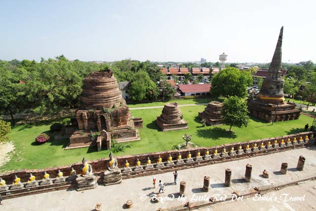 You can see the rows of restored Buddha statues that surround the temple. 