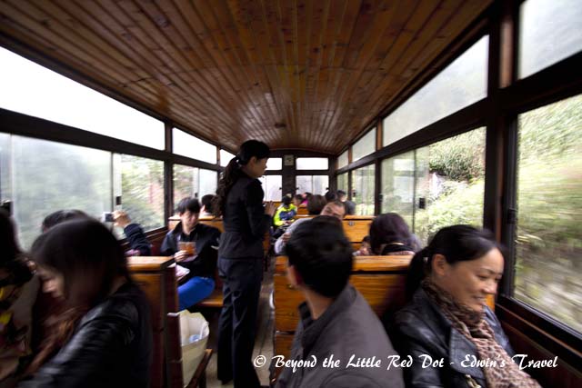 The tourist carriages are covered and have windows. This prevents coal ash from flying into your face.