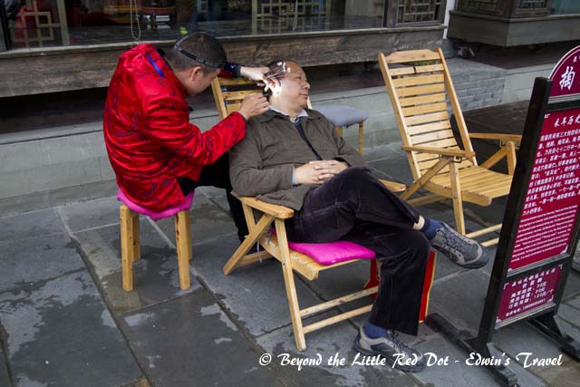 Ear cleaning in progress.