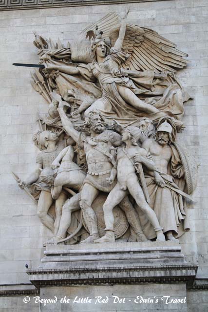 Close up of the sculptures on the sides. Why is there always one guy who isn't wearing pants?