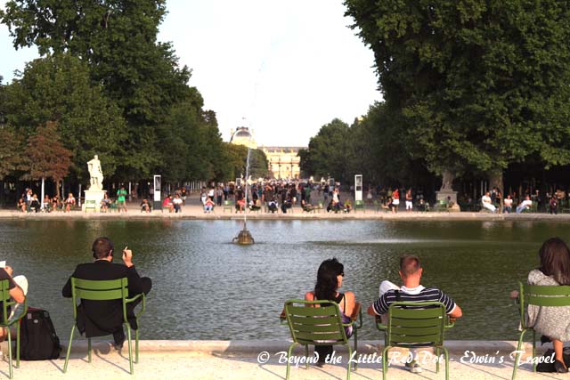 The Tuileries Gardens, with the Lourve Museum in the background.