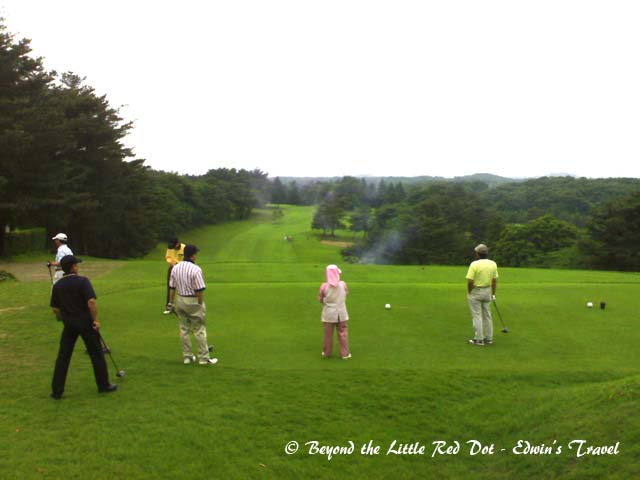 The first flight started off the game with a smoke ball. This is a pyrotechnic golf ball that explodes and leaves a trail of smoke after being hit. The Japanese use it to start off the game. The president of the company had the honour to hit it as an opening ceremony.