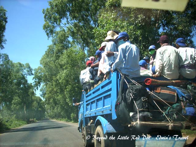 On the road to Phnom Penh. Our guide's ride was an old Ford imported from USA. Left hand drive and speedometer in miles per hour.