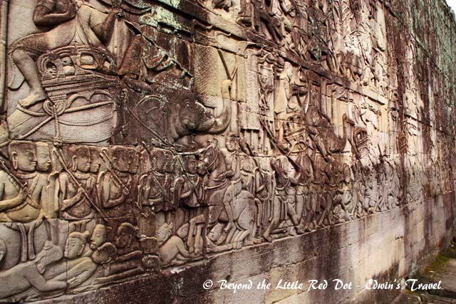 The walls of the temple are covered in stone carvings.