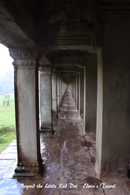 We took shelter under one of the long corridors that forms the walls around the inner temple.
