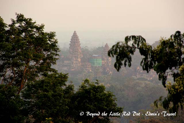 You can see Angkor Wat rising out of the trees from the top of the hill.
