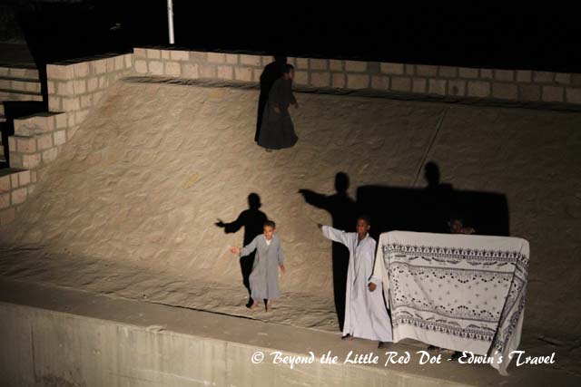 These guys help to secure the boats to the shore, but they do a sideline of selling rugs. Again, the same rules of showing you the goods, bargain, then throwing goods and  money to each other.