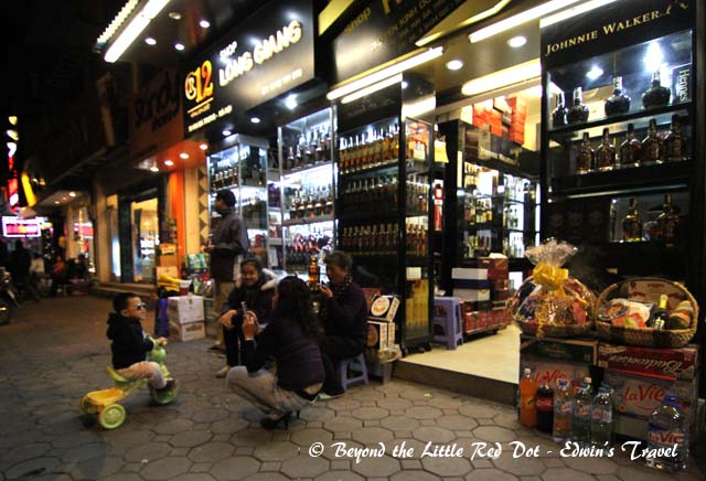 Shop owners relaxing in the cool winter air.