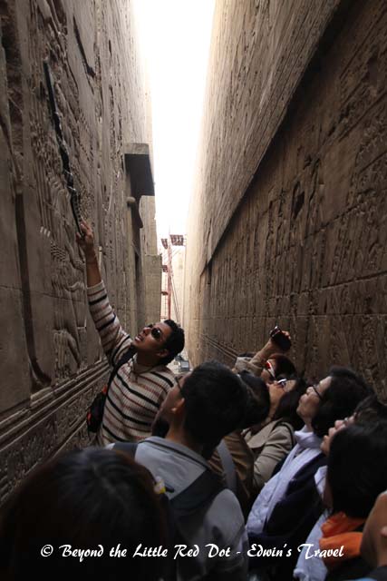 Our guide explaining the hieroglyphics on the wall.