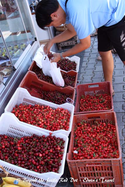 Buying cherries by the kilos. It's around $1 for 1 kg.