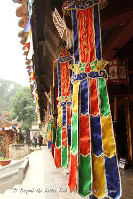Flags at the temple hall's entrance.