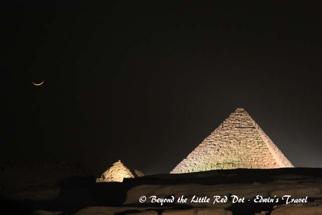 The Great Pyramids with the crescent moon.