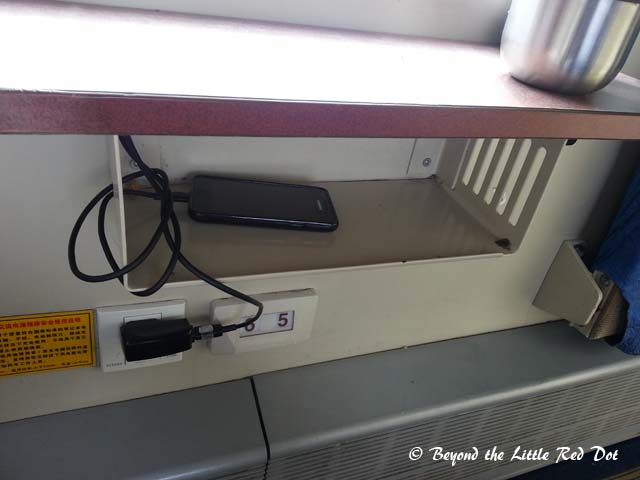 There are no electrical outlets in the cabins for the hard sleeper carriages. The outlets are found only along the common corridor. So you take the risk of losing your latest gadget if you don't look after it properly.