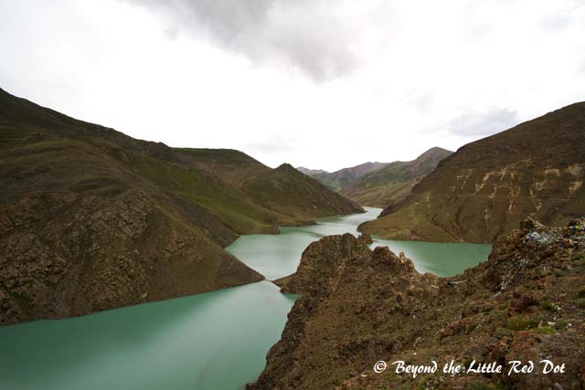 Yamdroktso Lake which appears green in colour.