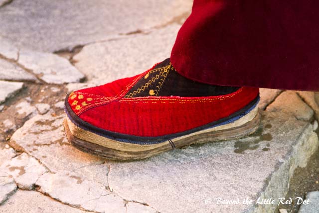The monks here all wear traditional shoes.