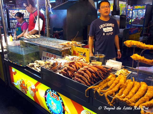 There are many stalls selling seafood. These are either fried or grilled. Look at the size of those tentacles.