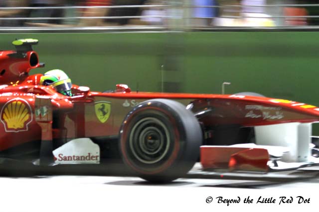 I can't tell, but F1 geeks will know which driver this is by the colour of their helmets.