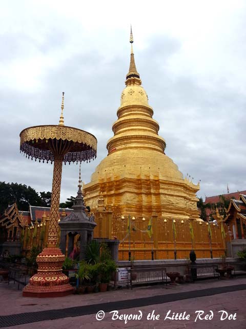 A golden stupa in the temple grounds.