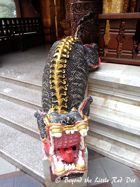 A mythical Naga creature guarding the entrance to one of the halls.
