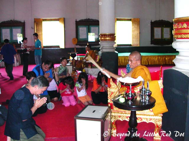 Receiving Buddha's blessing.