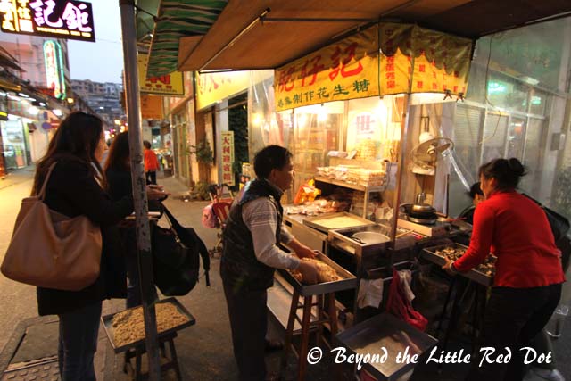 We passed by this old couple selling peanut candy. The woman on the left is a reporter from Taiwan trying to interview them for a travel magazine. We acted as interpreter, since the old couple only spoke Cantonese and the reporter spoke Chinese.