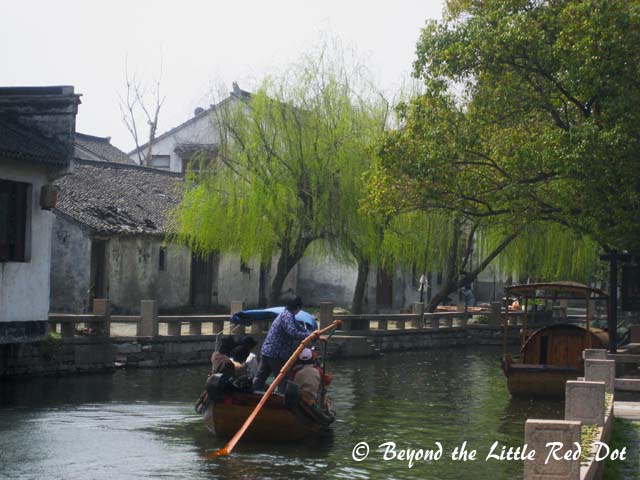 The village is surrounded by canals with willow trees along the sides. Definitely, the classical type of Chinese scenery.