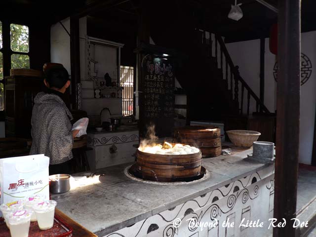 Amongst the buildings, you have many shops selling Chinese snacks, home brewed rice wine, souvenirs and handicrafts.