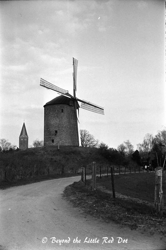 A medieval windmill scene.