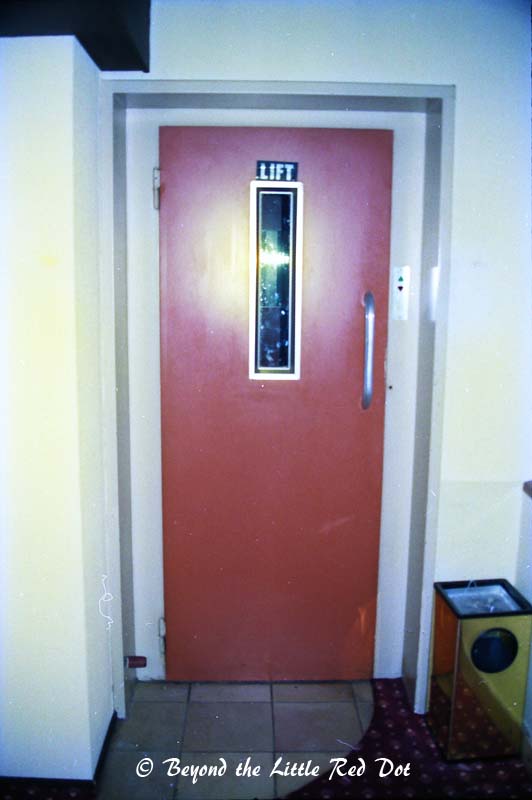 I checked into my hotel, a small one somewhere near the town centre. The lift was really tiny. It could only fit 1 person with luggage and you had to open the door manually. There was no inner door and you could see the wall slide past you as the lift moved up and down.