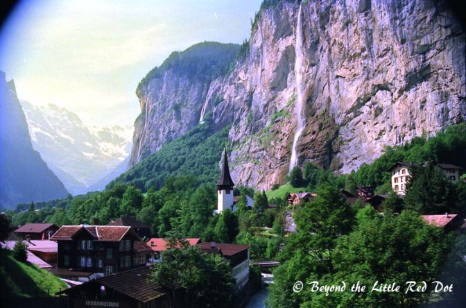 Waterfalls from melting snow fall on to the village of Lauterbrunnen.