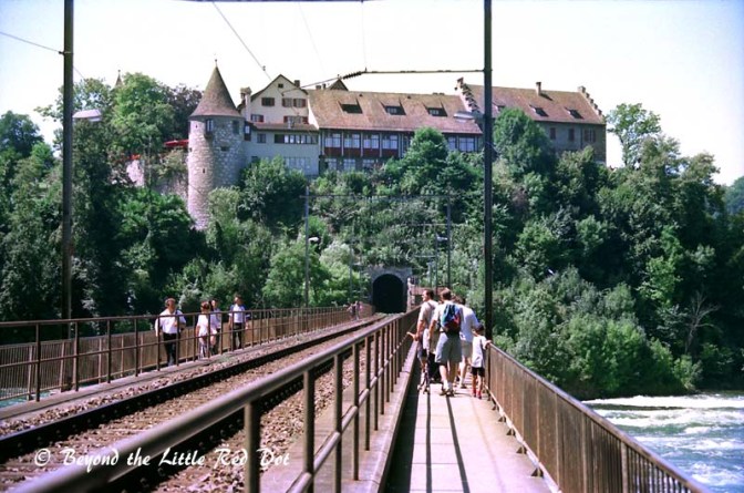 The rail bridge crossing the river. There is a castle that on the right bank of the river that you can visit.