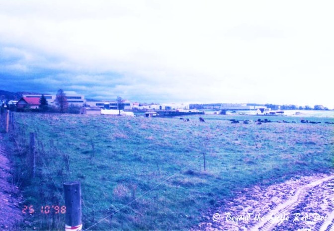 You can see the factory buildings in the distance. Right in front were pastures and cows.