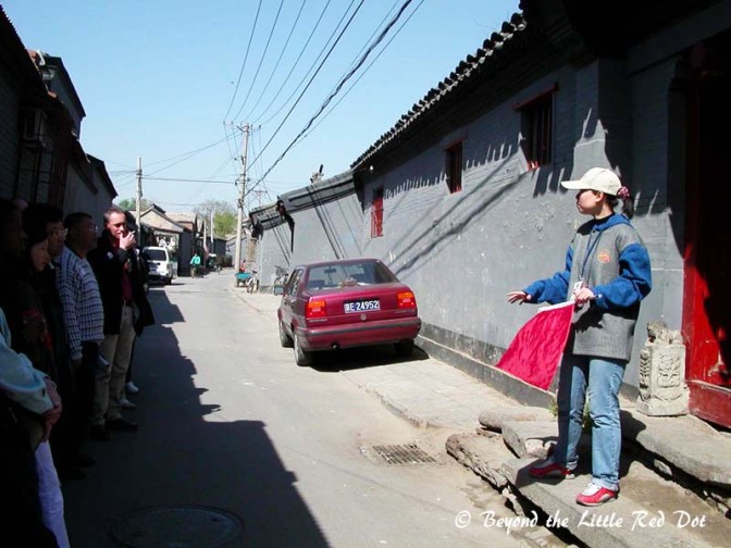 Our guide explaining the history and significance of the architectural elements in the hutong.