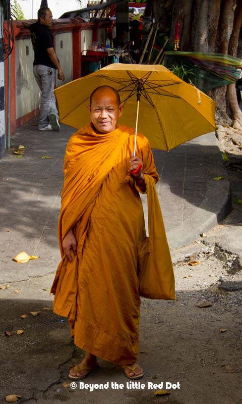 I bumped into this monk along the street and he obliged for a photo. Note the matching umbrella and his robes.
