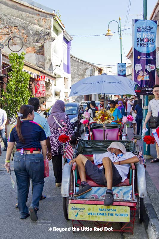 Or, you could hire one of the trishaws to bring you around. Once the driver wakes up, that is.