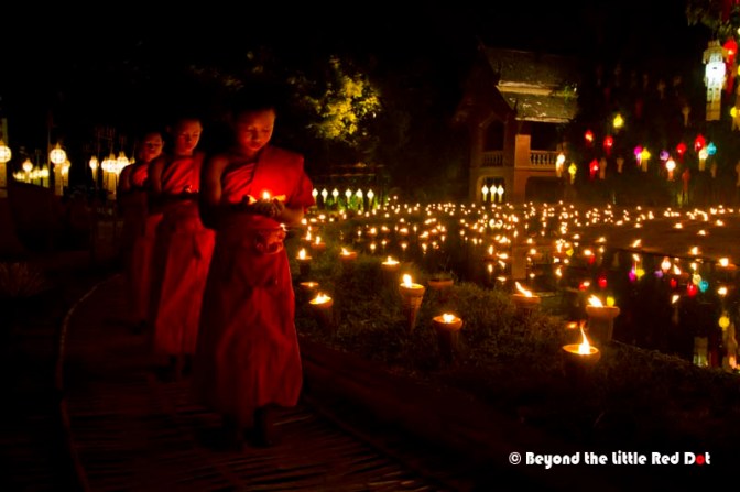 The novice monks now came in, each holding an oil lamp and praying.