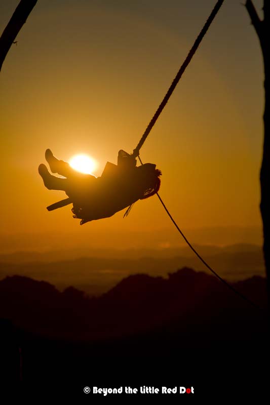 I managed to capture this Akha kid with the Sun behind her.