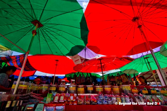 Colorful umbrellas form the roof of the market.