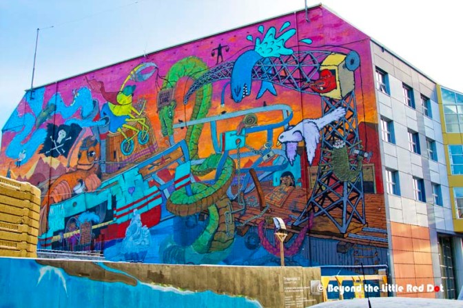 Some of the colourful wall paintings along the street towards the Old Harbour.