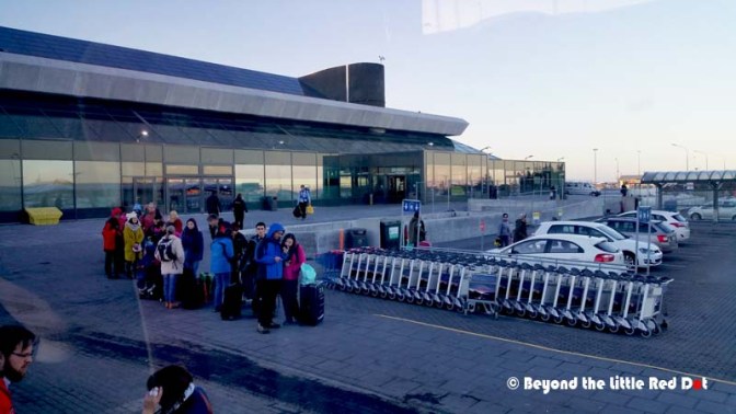 I booked the Grayline bus service online and reserved my seat based on my flight and date. Those people waiting down there are those that booked the bus service only when they landed. It's below zero degrees and standing there waiting is not pleasant.
