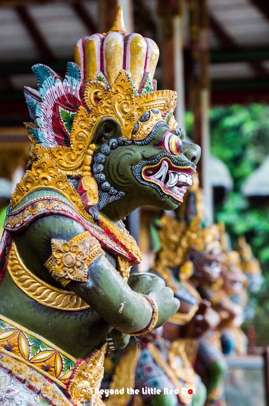 Intricately carved and painted figures from Hindu folklore line the main temple.