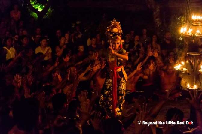 The dancers have elaborate makeup and costumes.