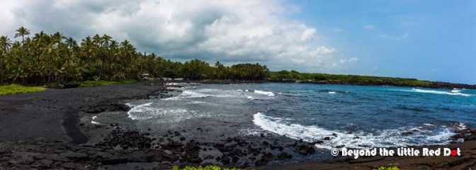 The black sand is from the volcanic rocks that have eroded.