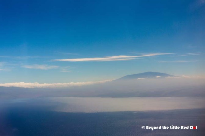 Our first sight of Big Island is the imposing silhouette of Mauna Loa above the clouds.